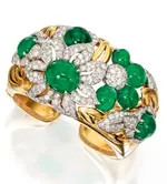 Lot-62-18-Karat-Gold-Emerald-and-Diamond-Cuff-Bracelet-Trabert-Hoeffer-Mauboussin-Circa-1940.webp