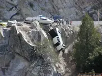 park-truck-down-cliff-towing-boat.webp