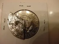 reale on half dollar.webp