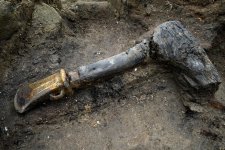 Bronze-socketed-axe-with-a-wooden-haft_-Must-Farm-Cambridge-Archaeological-Unit.jpg