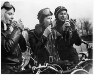 women-bikers-in-leather-helmets.png