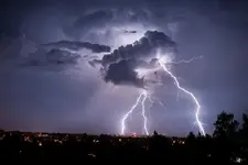 lightning-strikes-from-a-cloud-during-a-thunderstorm-above-the-city-of-goerlitz-eastern-germa...webp