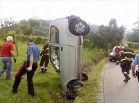 car-standing-on-nose-in-small-roadside_ditch.jpg