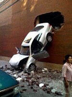 car-through-2nd-story-brick-wall.jpg