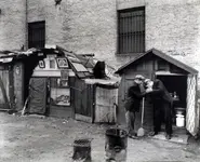 Huts_and_unemployed,_West_Houston_and_Mercer_Street,_Manhatt_-_(3109787453).webp