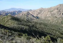 4 peaks from ridge above pit mine.webp