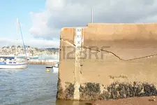 81338298-water-depth-marker-with-depth-in-feet-on-sea-wall-in-teignmouth-devon-england.webp