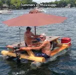 cool-motor-boat-table-umbrella-river.webp