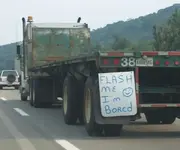 car-humor-joke-funny-traffic-flash-me-im-bored-truck-driver.webp