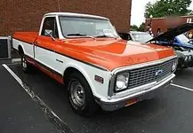 orange and white truck.webp