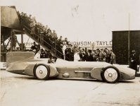 Sir_Malcolm_Campbell_at_the_wheel_of_the__Bluebird_,_with_crowd,_1926_-_1936.jpg