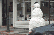 girl scared by snowman.gif