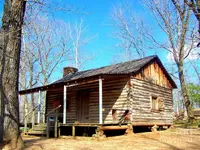 one-room-pioneer-log-cabin-kathy-white.webp