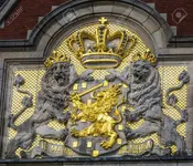 77430082-netherlands-coat-of-arms-amsterdam-holland-netherlands-on-building-facing-the-canal-...webp