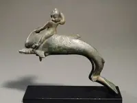 Roman bronze Circa. 2nd to 3rd Century AD  Boy riding a dolphin.webp