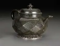 Polished diamond faceted serpentine teapot circa 1700.webp