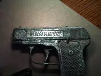 close-up of hawkeye cap gun.webp