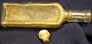 bottle and doll head.JPG