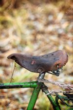 49576508-old-leather-seat-of-a-bicycle-worn-saddle.jpg