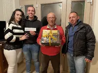 The Masucci family holding the thank you basket - small.webp