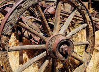 wooden-wagon-wheel-axle-weathered-rusted-rustic-western-spoke-hub-stands-sunlight-background-8...jpg