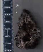 Raw Ore after heat test w molten droplets.jpg