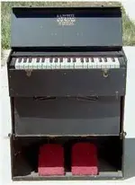 whitefolding reed organ.webp