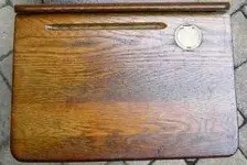 Antique school desk with ink well.webp