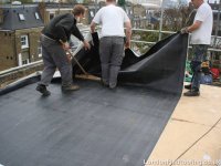 EPDM-flat-roof-fulham-laying-sheet.JPG