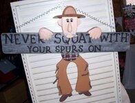 western-cowboy-sign-never-squat-with-your-spurs-on-wall-hanging.jpg