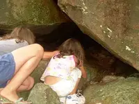 Girls explore cave.webp