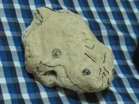 frog with carved V shape in the head.webp