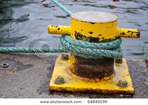 stock-photo-rope-tied-to-bollard-on-ship-dock-54849199.jpg