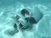 skull in sand underwater.webp