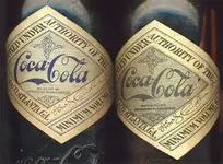 Coke Labels with repro on left - original on right.webp