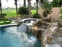 a Waterfall-jacuzzi & golf course.webp