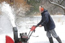 3968617-man-using-a-snow-blower-in-winter.jpg