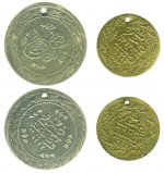 Original_coin_and_replica_used_as_ornaments.jpg