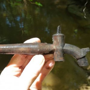Complete 18th century keg tap; the long tapered end would have been hammered into an oak barrel containing ale or rum.   I found this in a creek that 