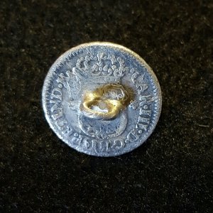 1761 Spanish Half Real coin that was made into a cufflink