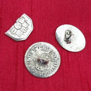 Three silver cufflinks found at a colonial home site
