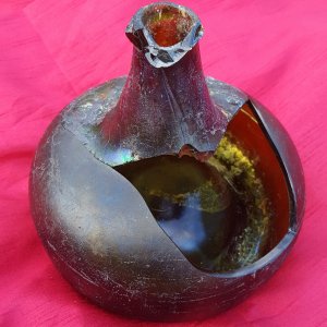 Reconstructed early 1700s black glass "onion" bottle