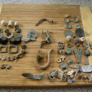 Civil War/Colonial Digs - March 2010-Suffolk/Isle of Wight County---Artillery Sword Scabbard tip, 

Silver spoon, flat buttons, musketballs, Kepi Buck