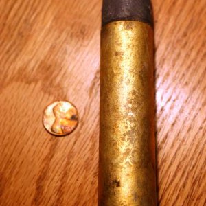 20 mm round, no headstamp.
 can find no info on this...
help is appreciated!!