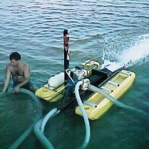 Dale using my 3" dredge in shallow water.