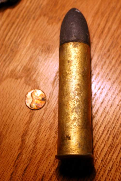 20 mm round, no headstamp.
 can find no info on this...
help is appreciated!!