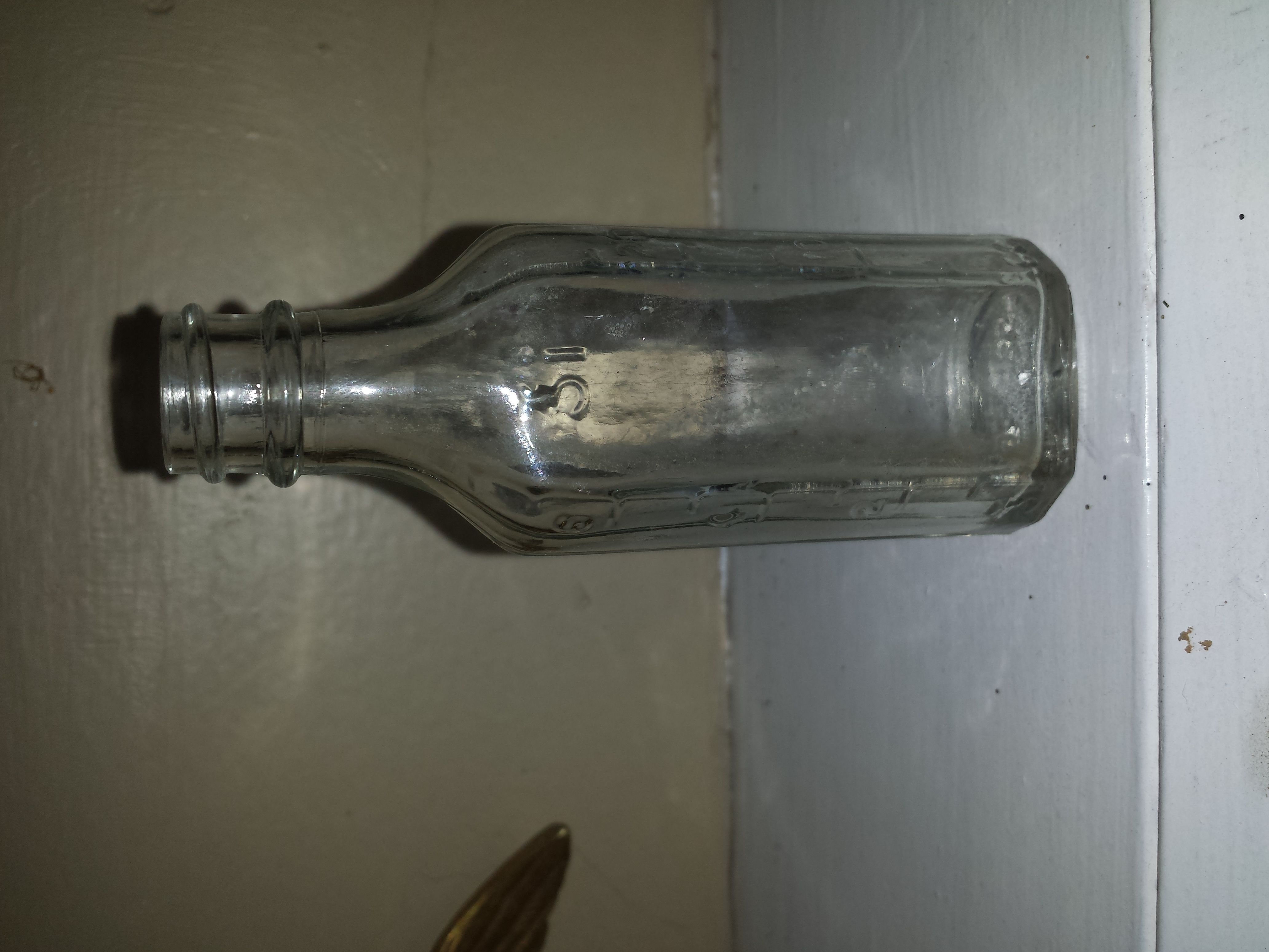 20150724 A small bottle made in 1935 by Knox Bottle Company in Jackson, MS. It was found while digging the hoe blade in another photo on private prope