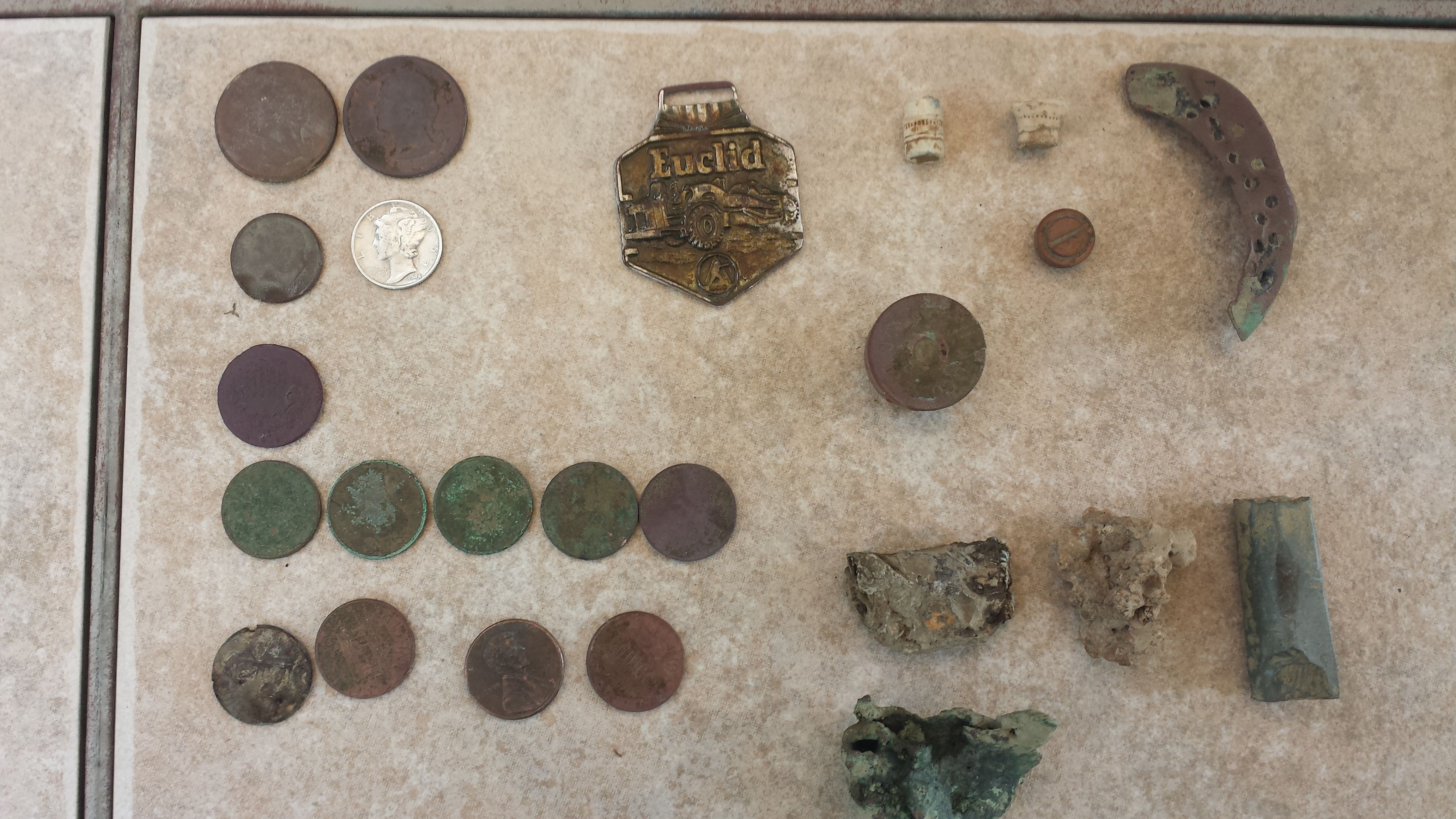 20150828 182712  Killgore Farm  3 hr.  Shield Nickle, 5 wheats  1916, 32, 41, 44, & 52D, also an Euclid watch fob.  $0.84 total