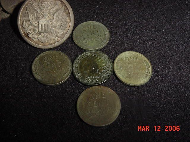 A big US overcoat button, an Indian, and 4 Wheaties found in Hesperia, MI. The button is actually made of PLASTIC...I found it because my machine pick