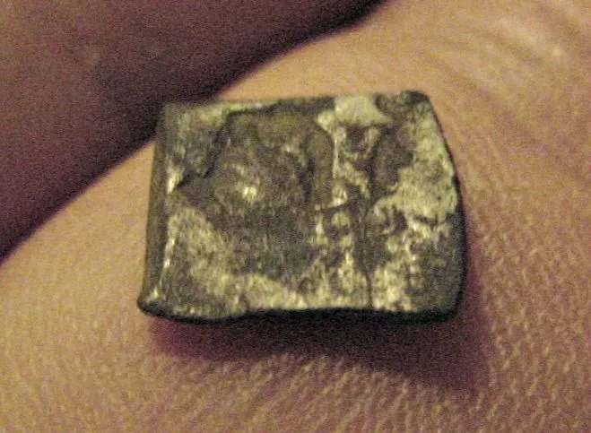 "BIT" CUT PIECE OF SILVER - DONT KNOW IF IT WAS CUT FROM A COB -BUT YOU CAN SEE PART OF THE SPANISH CROSS (THESE WERE SUPPOSEDLY WORTH A PINT OF ALE A